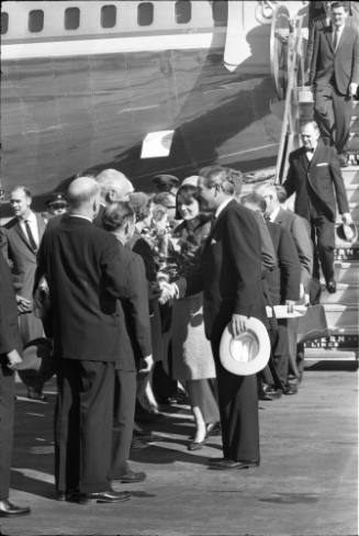 Image of Mrs. Kennedy and John Connally greeting local dignitaries at Love Field