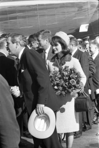 Image of the Kennedys and John Connally greeting local dignitaries at Love Field