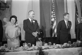 Image of President Kennedy and the Johnsons at the Chamber of Commerce breakfast