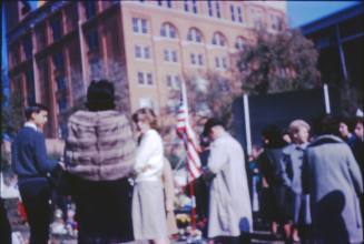Image of crowds and flowers in Dealey Plaza