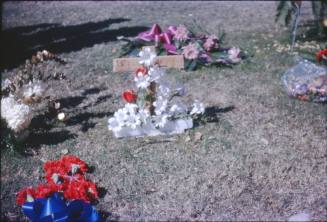 Image of flowers and a cross in Dealey Plaza