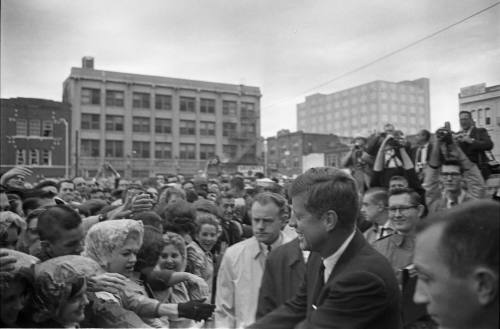 Image of President Kennedy greeting the crowd outside the Hotel Texas