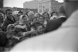 Image of President Kennedy with crowds outside the Hotel Texas