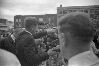 Image of President Kennedy with the crowd outside the Hotel Texas