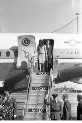 Image of President and Mrs. Kennedy deplaning at Love Field