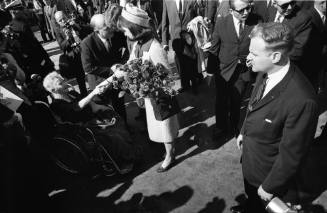 Image of Mrs. Kennedy shaking hands with Annie Dunbar at Love Field