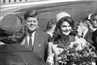 Image of the Kennedys greeting local dignitaries at Love Field