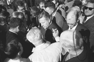 Image of Senator Ralph Yarborough surrounded by press outside Parkland Hospital