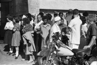 Image of people outside Parkland Hospital awaiting news of President Kennedy