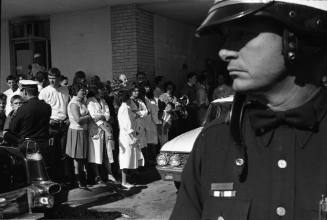 Image of people outside Parkland Hospital awaiting news of President Kennedy