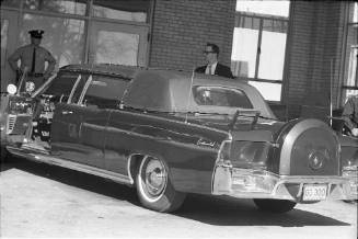 Image of the presidential limousine with top attached at Parkland Hospital