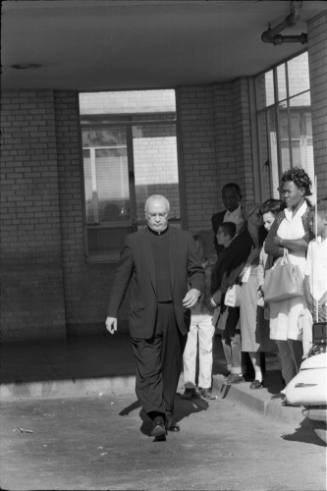 Image of Rev. James N. Thompson leaving Parkland Hospital