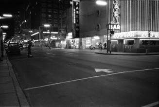 Image of Commerce Street in downtown Dallas the evening of November 22, 1963