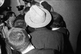 Image of a crowded hallway at Dallas Police Headquarters