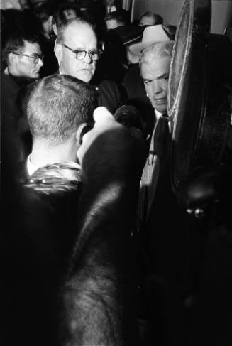 Image of Jesse Curry and Henry Wade talking with reporters