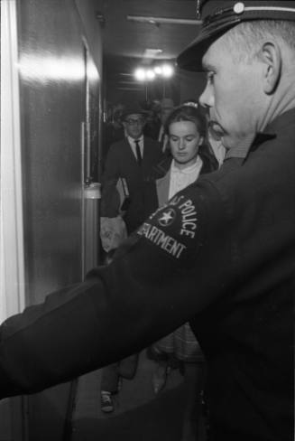 Image of Marina Oswald entering the Homicide and Robbery Bureau
