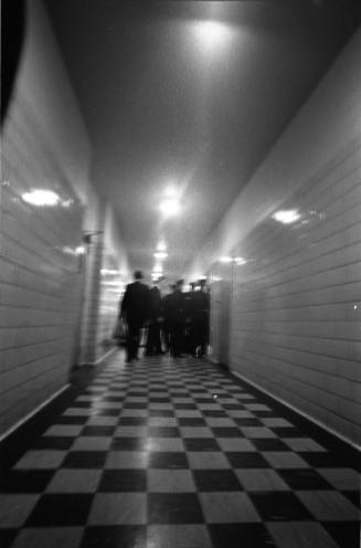 Image of police officers in the hallway outside the Parkland Hospital morgue