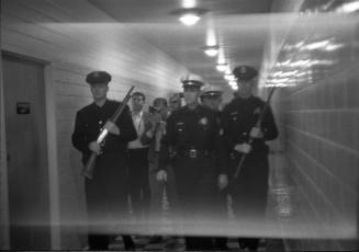 Image of Dallas Police officers in the hallway at Parkland Hospital