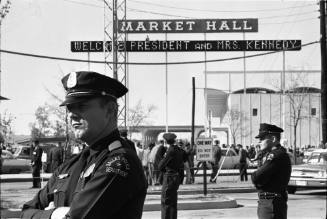 Image of Dallas Police officers standing guard outside the Dallas Trade Mart