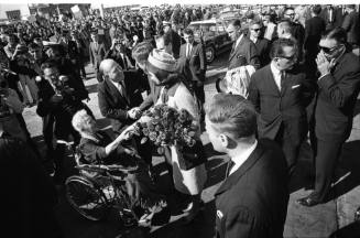 Image of the Kennedys greeting Annie Dunbar at Love Field