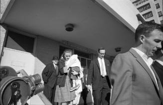 Image of Robert Oswald and Marina Oswald leaving Parkland Hospital
