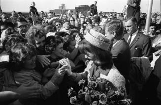 Image of the Kennedys greeting the crowd at Dallas Love Field