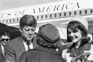 Image of the Kennedys greeting a woman at Love Field