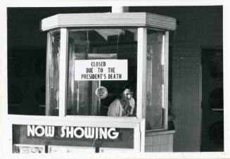 Black and white photograph of the box office of the Texas Theatre in Oak Cliff