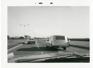 Photograph of John F. Kennedy's hearse between Parkland Hospital and Love Field