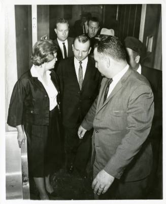 Photo of Jack Ruby and others walking through a doorway