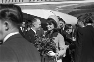 Image of Jackie Kennedy and President Kennedy greeting dignitaries at Love Field