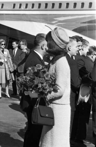 Image of Jackie Kennedy greeting dignitaries at Love Field