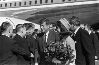 Image of President and Jackie Kennedy greeting local dignitaries at Love Field