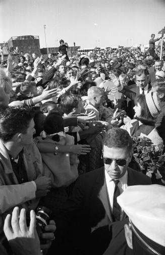 Image of President and Jackie Kennedy greeting the crowd at Love Field