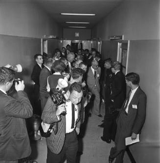 Image of reporters in hallway at Dallas Police Department