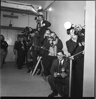 Image of photographers and reporters in the courthouse for the Ruby trial