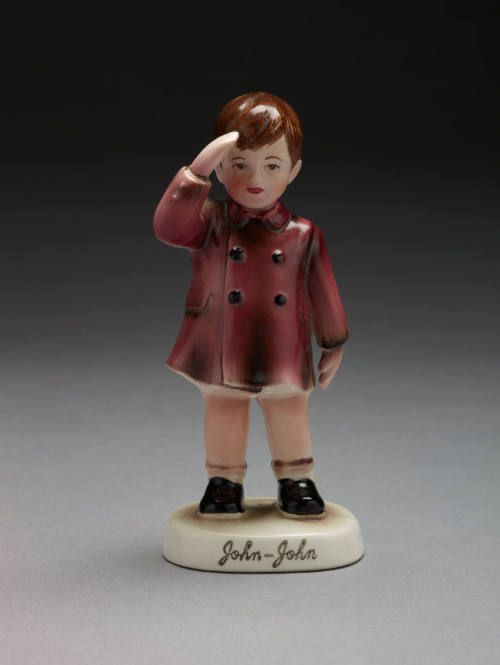 Ceramic figurine of John F. Kennedy, Jr., saluting
