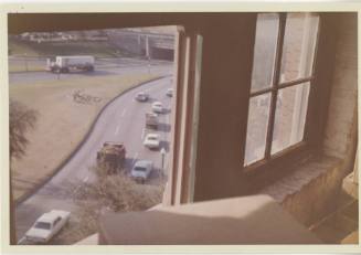 Color photo of the view of Dealey Plaza from the sixth floor corner window
