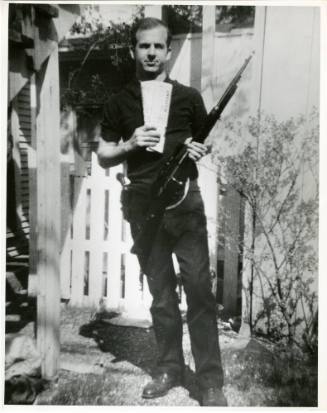 Photograph of Lee Harvey Oswald holding a rifle