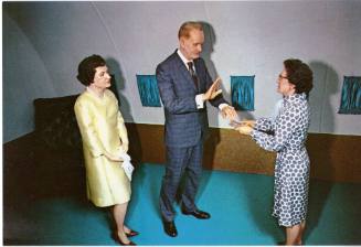 Postcard of wax museum tableau showing President Johnson's swearing-in ceremony