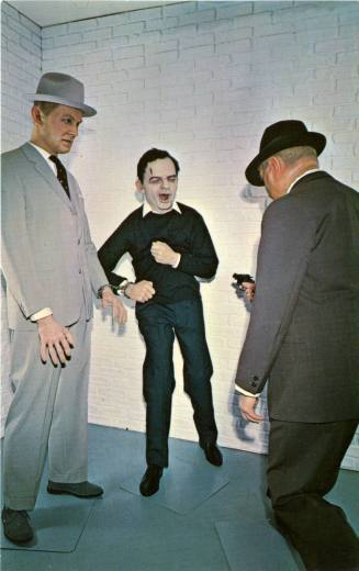 Postcard of a wax museum depiction of Jack Ruby shooting Lee Harvey Oswald