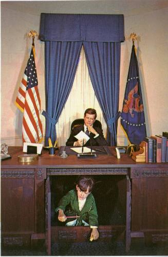 Postcard of a wax museum depiction of President Kennedy in the Oval Office with