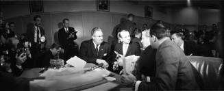 Jack Ruby talking with his lawyers during his change-of-venue hearing