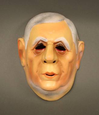 Plastic Halloween mask in the shape of a caricature of Charles de Gaulle