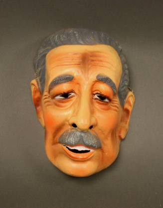 Plastic Halloween mask in the shape of a caricature of Harold Macmillan