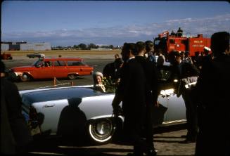 Image of Lady Bird Johnson in the vice presidential car at Love Field