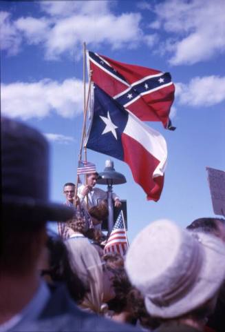 Image of crowd and flags at Love Field