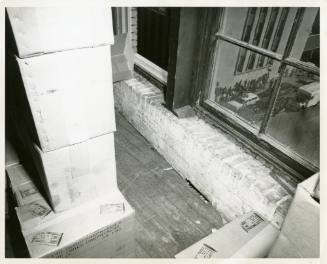 Photograph of spent rifle shells found on the floor