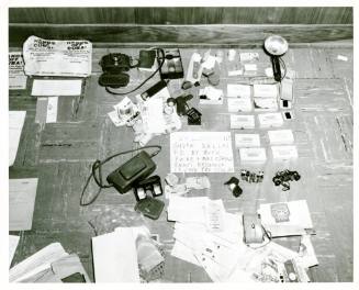 Black and white police photograph of objects belonging to Oswald