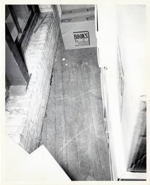 Photograph of spent rifle shells found on the floor